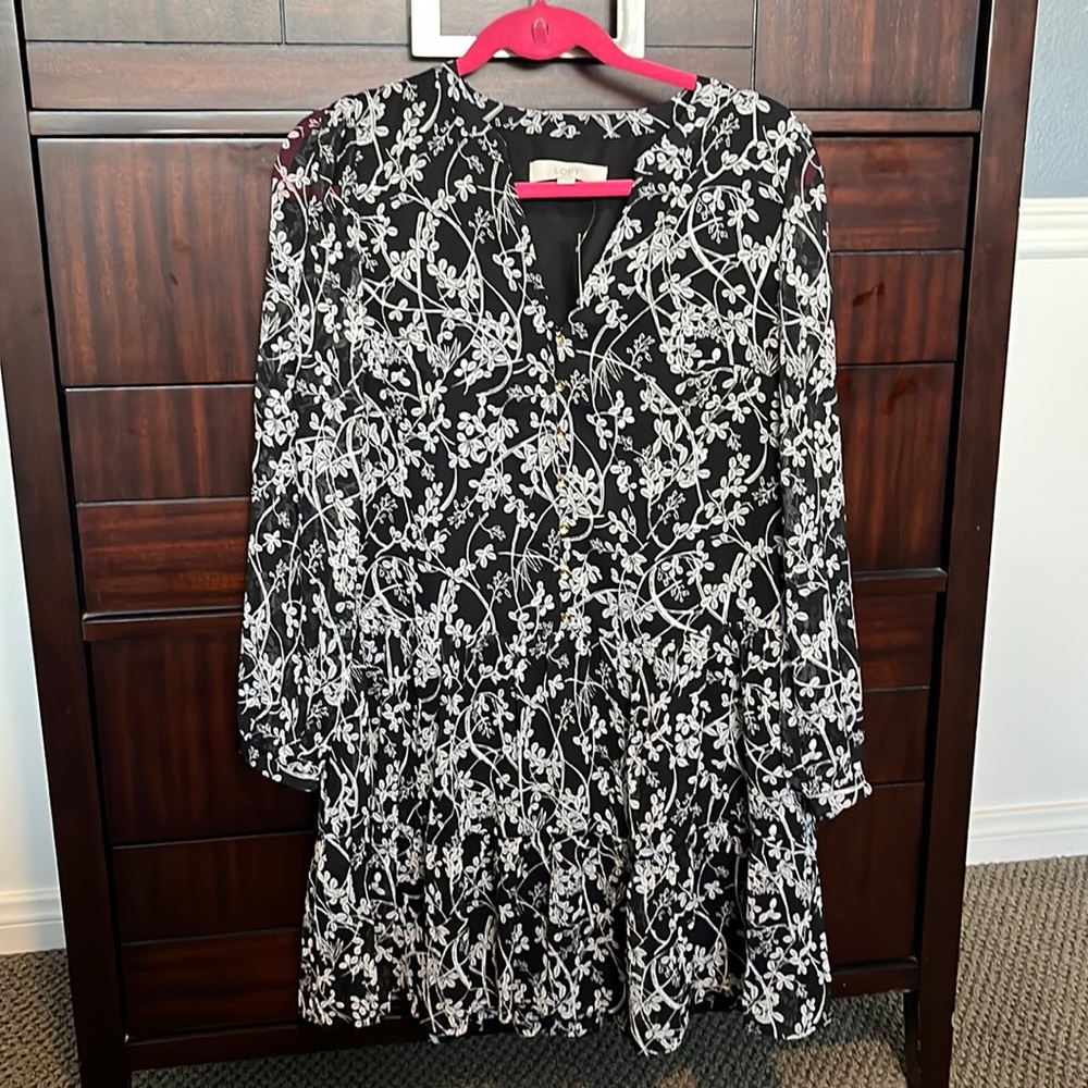 It’s a black floral dress has never been worn. Size small from The Loft